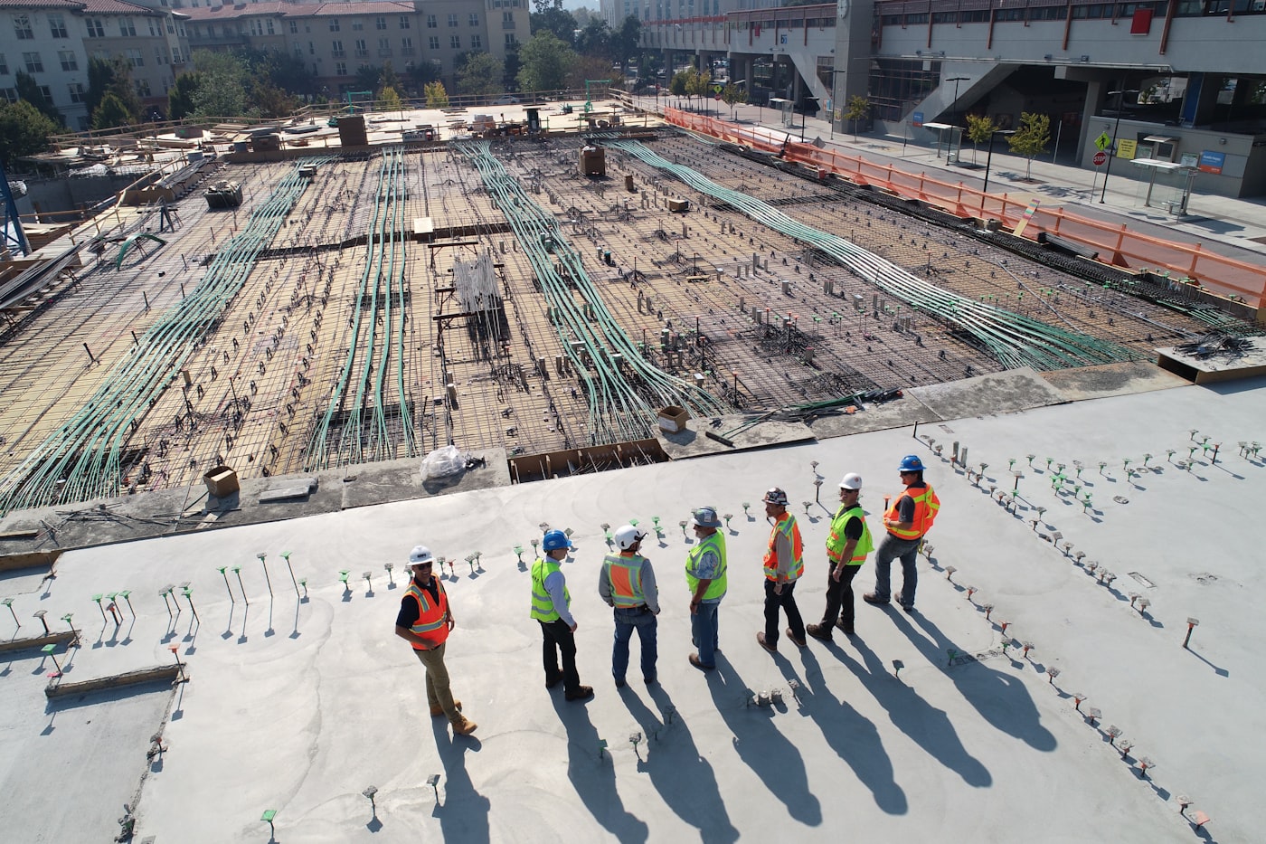 Construction crew reviewing a job site and planning work phases