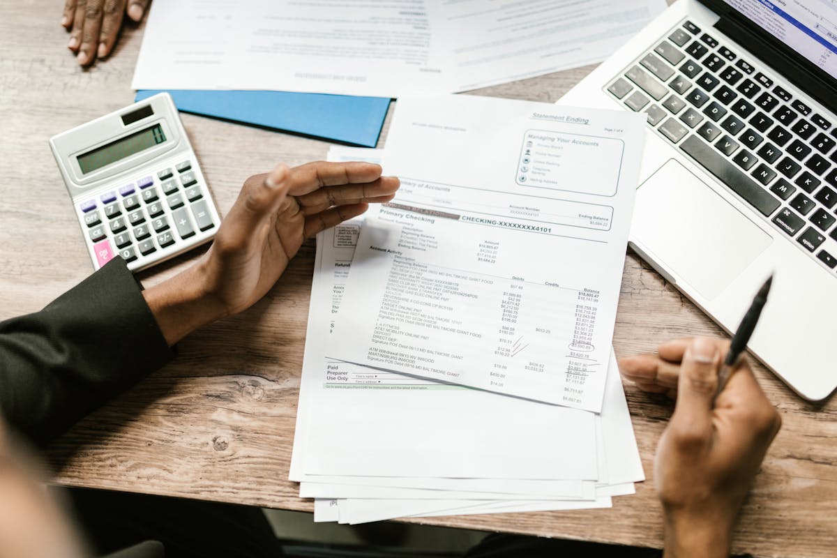 Business payroll paperwork and office calculations in progress