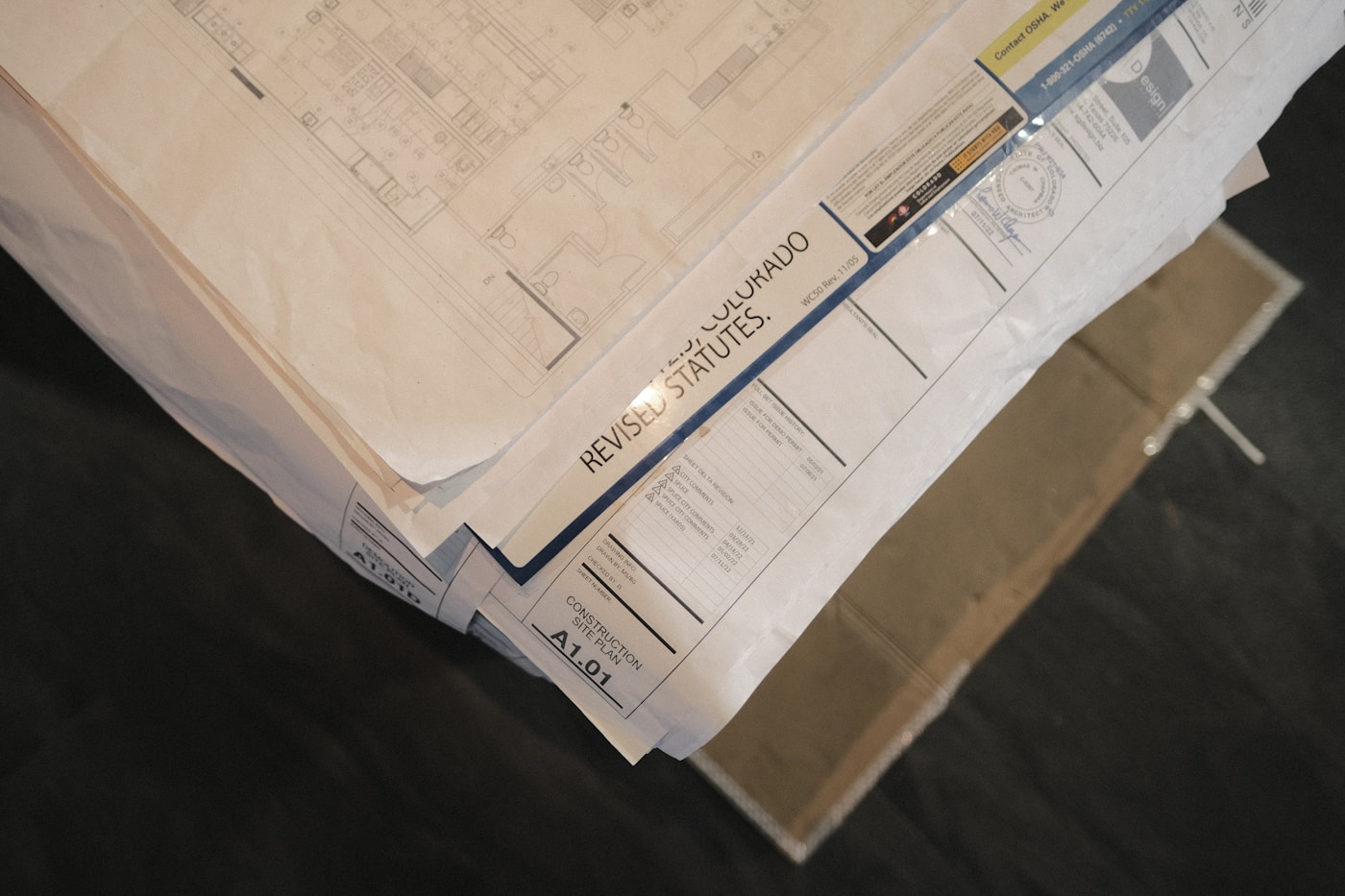 Organized business paperwork and source documents prepared for a reporting review