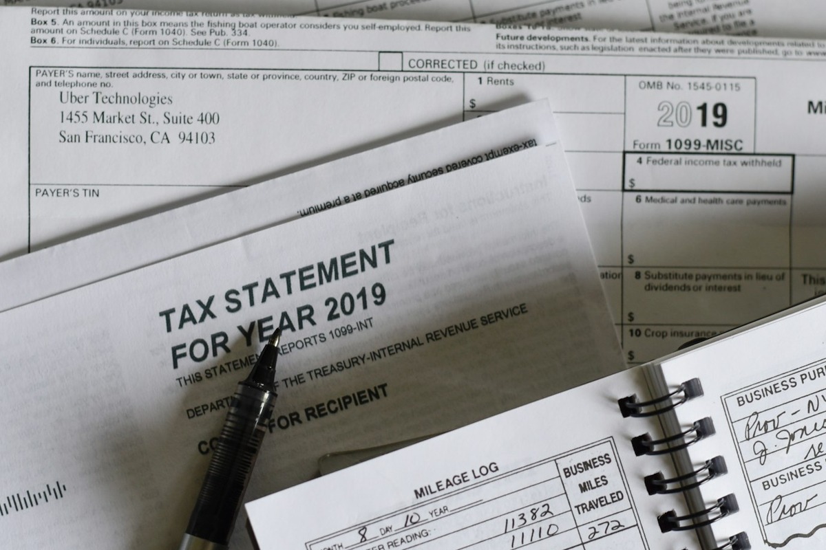 Year-end tax forms and support records organized for review